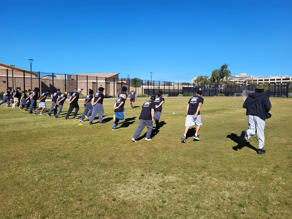 Youth lined up to run on football field