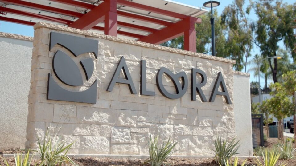 Brick wall with "Alora"