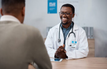 smiling doctor with patient