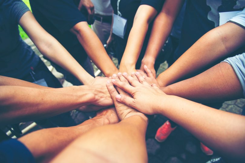 hands in a huddle