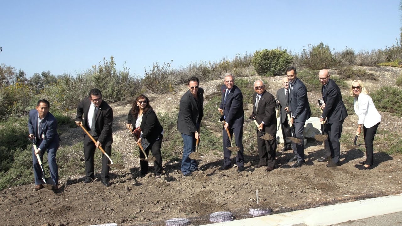 a group of people holding shovels