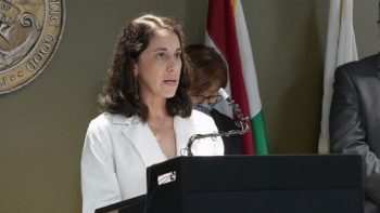 doctor speaks at a podium
