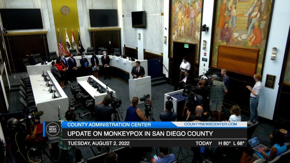 a press conference in a board chambers
