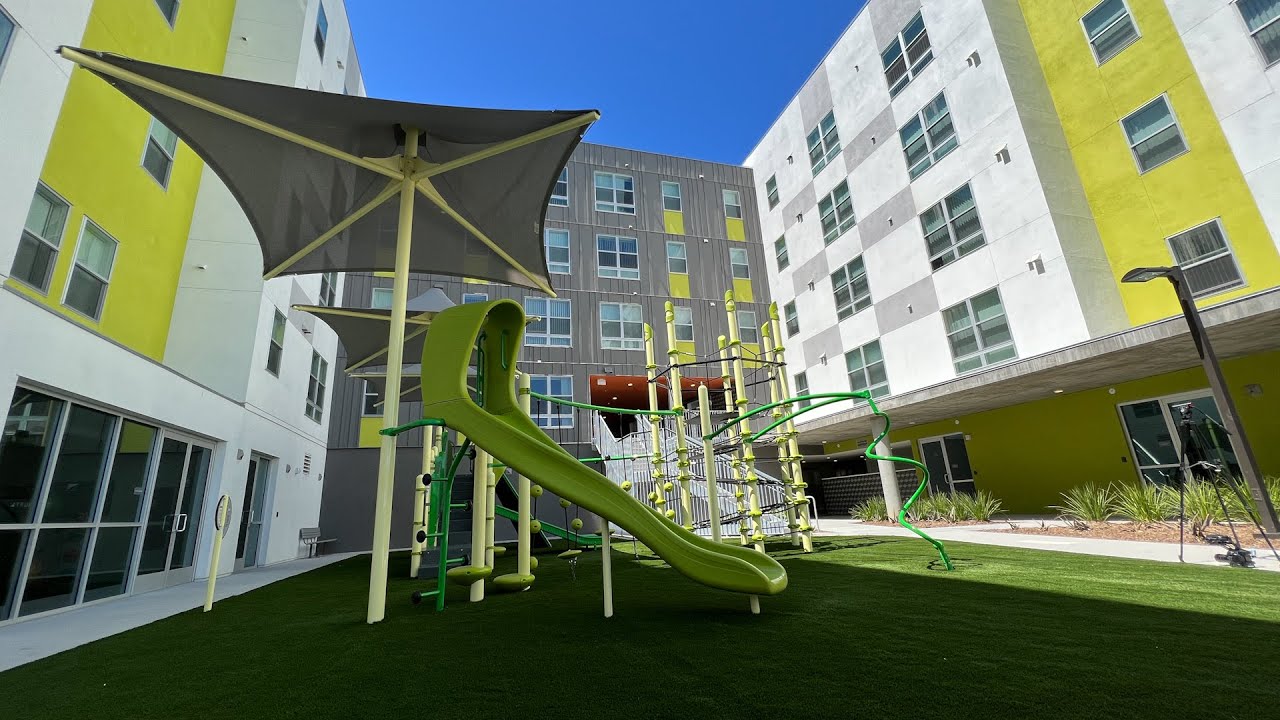 a housing courtyard with playground equipment