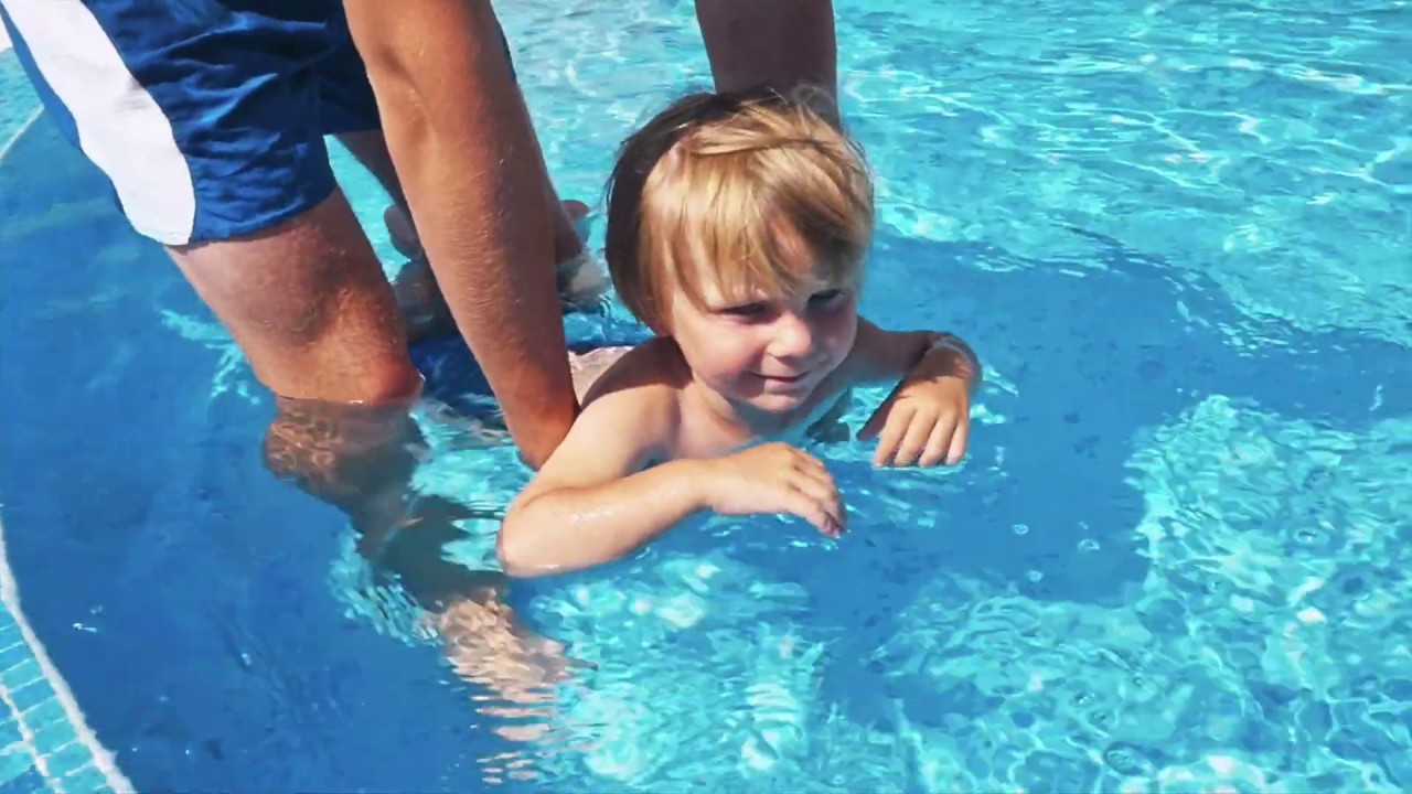 Child swimming in pool