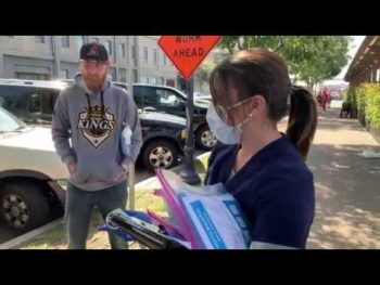 nurse handing out hygiene kits