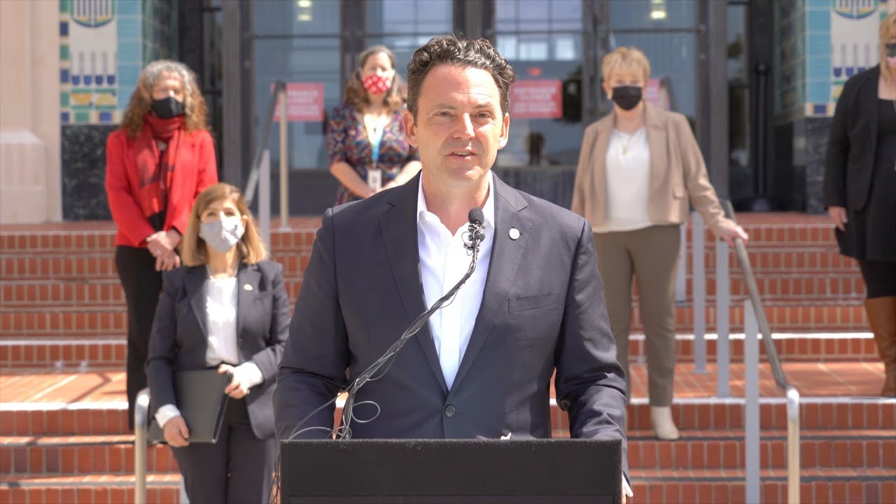 Chair Fletcher speaks at a podium in front of County Administration Center