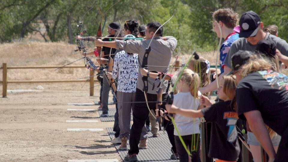 people trying archery in a archery range
