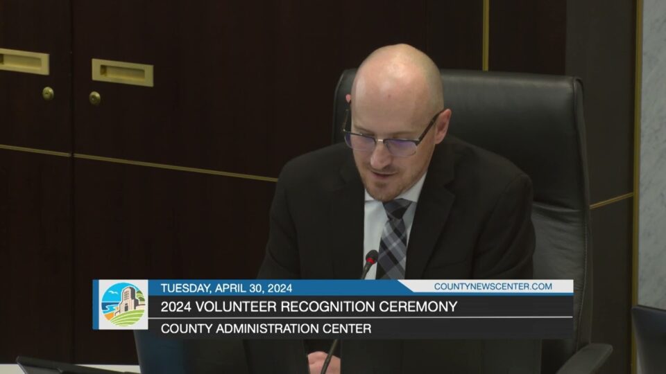 Clerk of the Board Andrew Potter speaking in the chambers