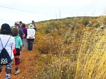 Hikers listening to guide