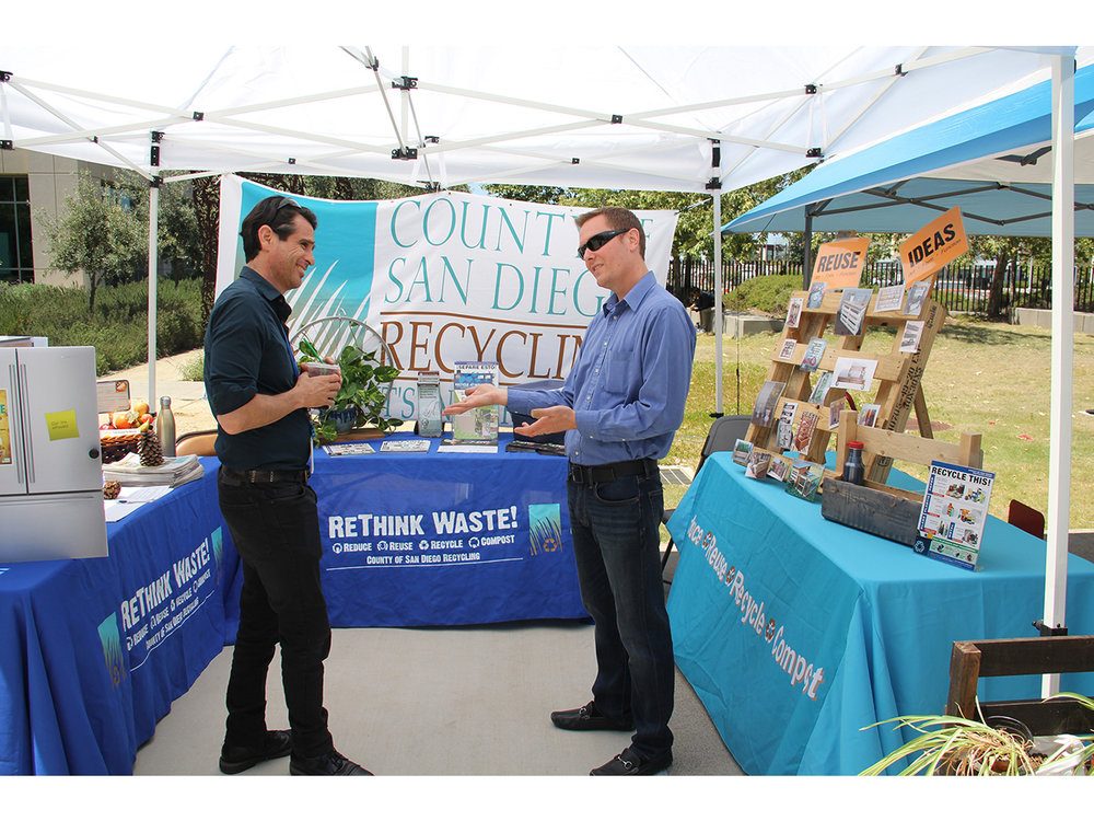 Two people talking at Earth Day Fair