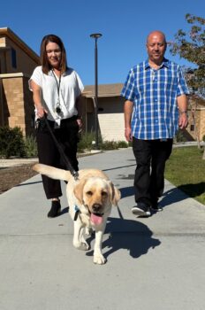 therapy dog and her handlers