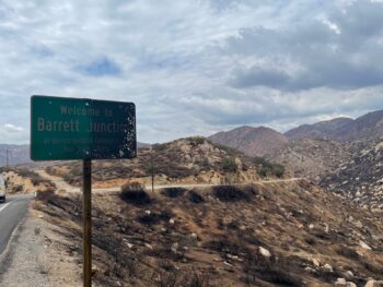 Street sign of Barrett Junction charred