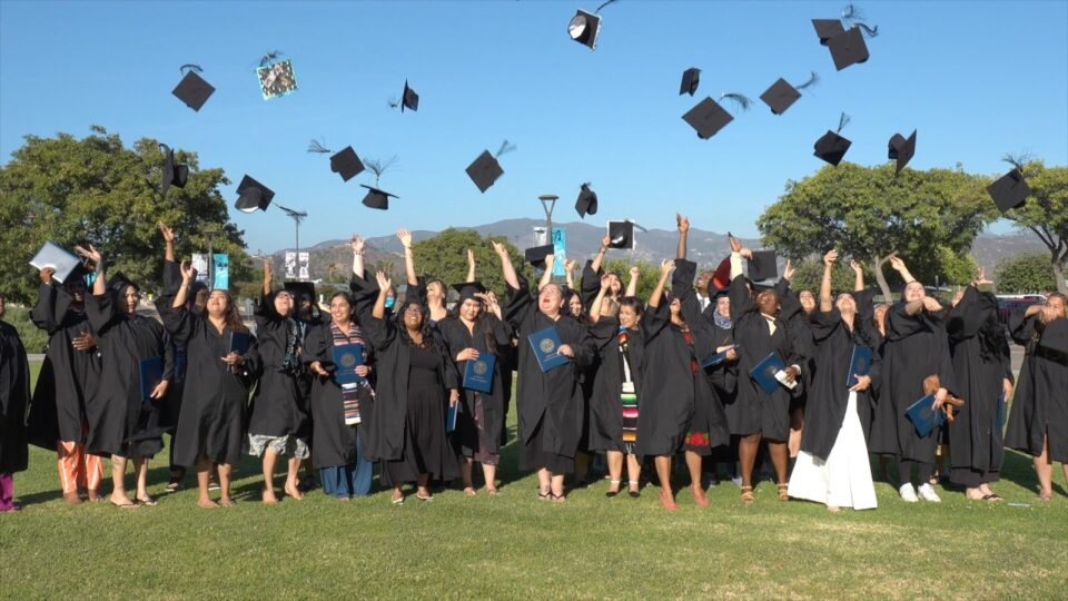grads throw hats in air