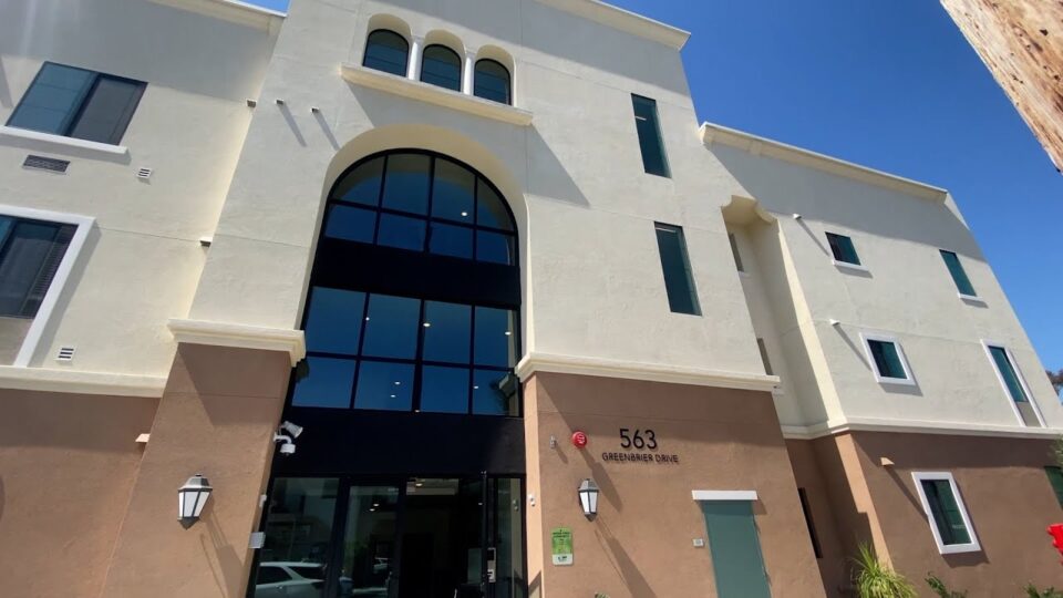 front of building with blue sky