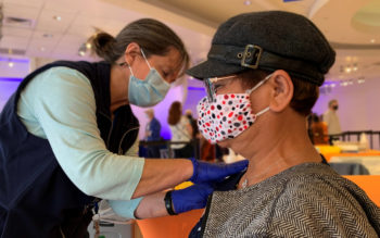 Person gets COVID-19 vaccine