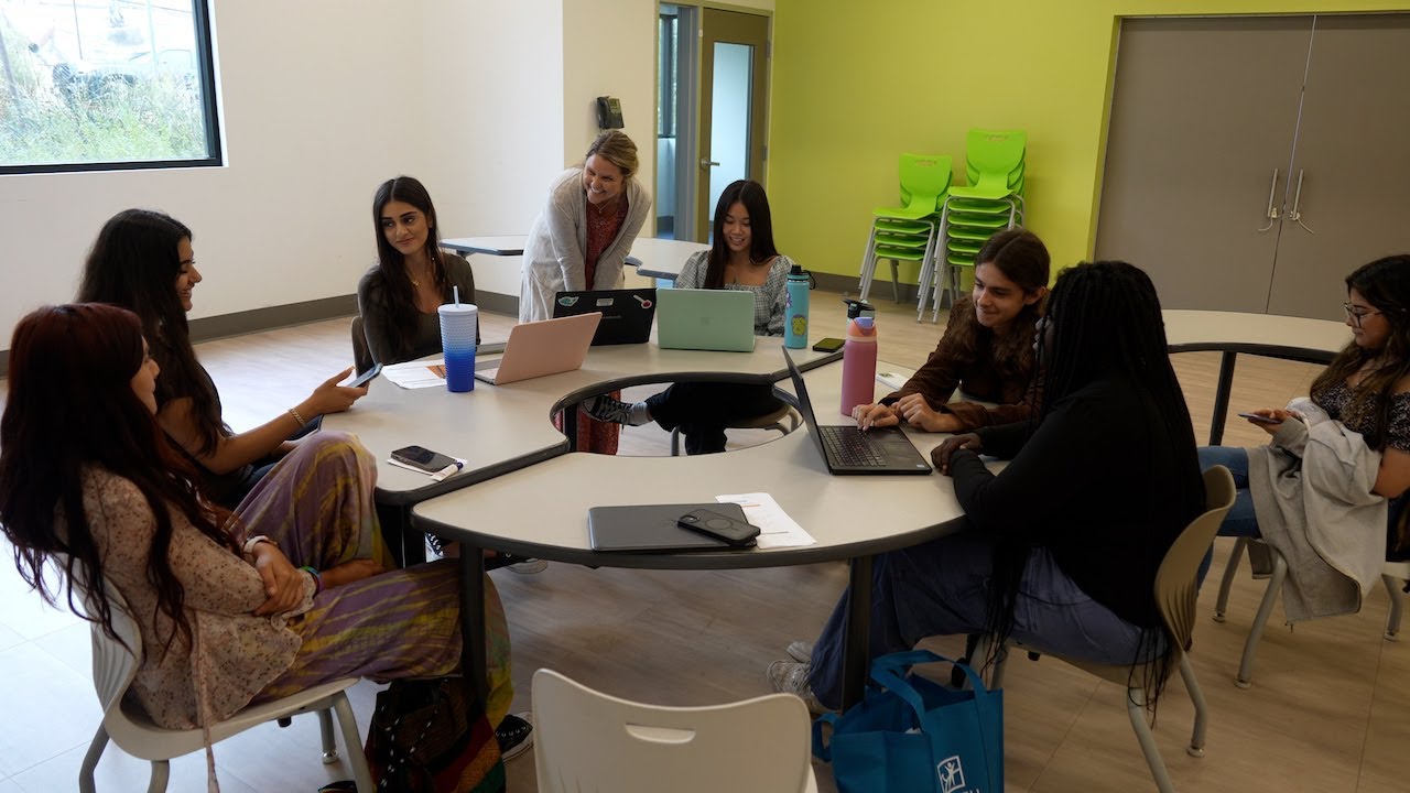 people sit around round table