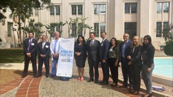 group stands outside the County Administration Center
