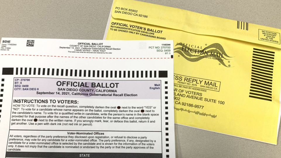 ballot with official mail-in envelope
