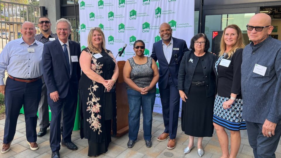 a group stands with Supervisor Jim Desmond