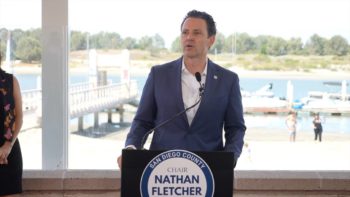 Chair Fletcher speaking at a podium