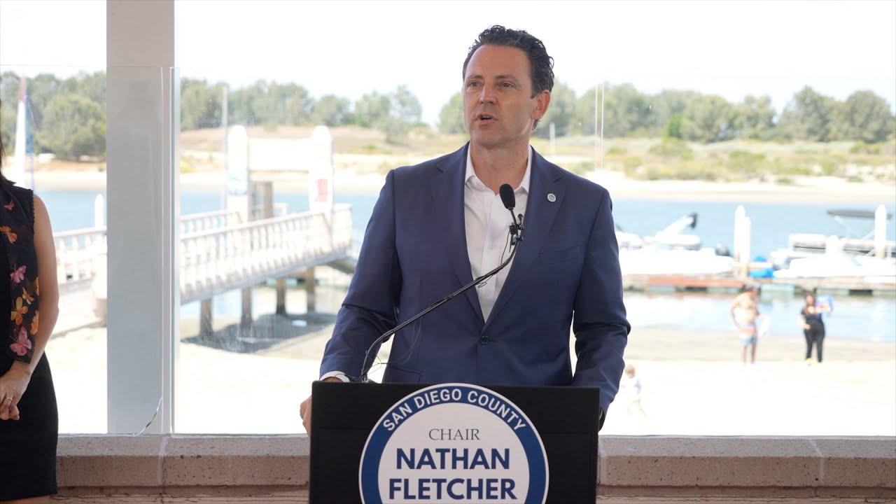 Chair Fletcher speaking at a podium