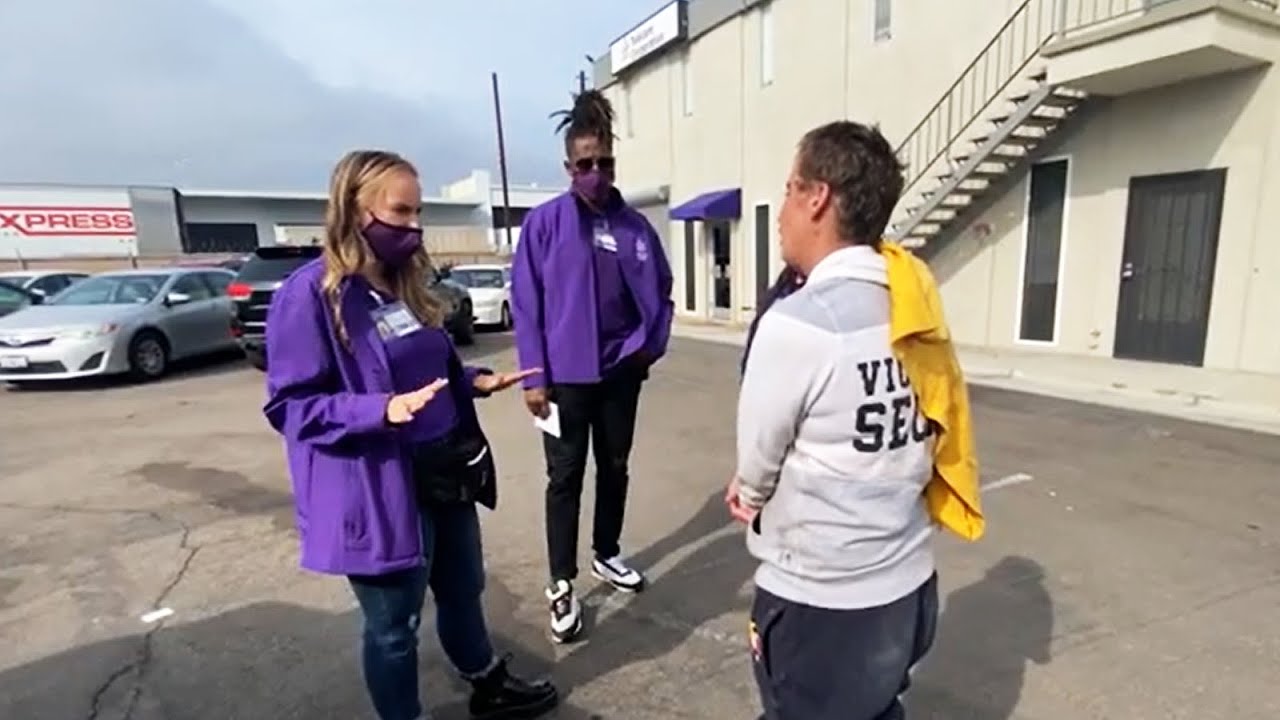 MCRT speaks with an individual in a parking lot