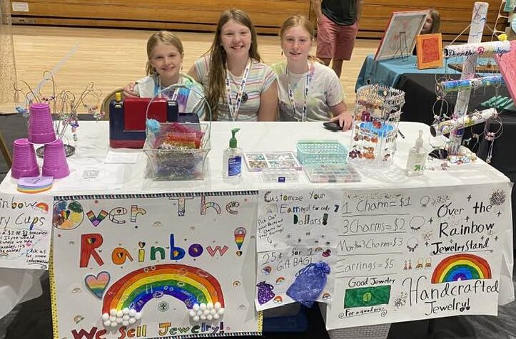 Photo of the Over the Rainbow Jewelry team at their table at the Santee Children's Business Fair organized by Momentum Tutoring