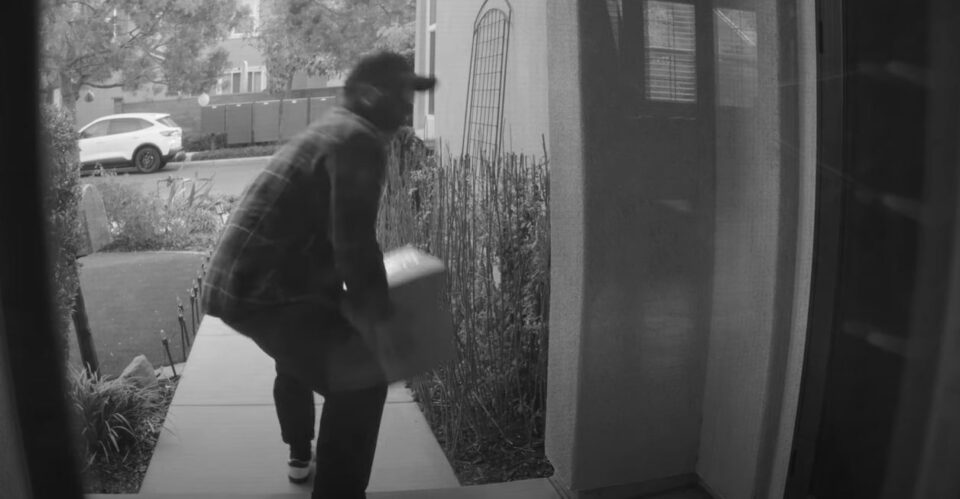 Man steals package from a porch