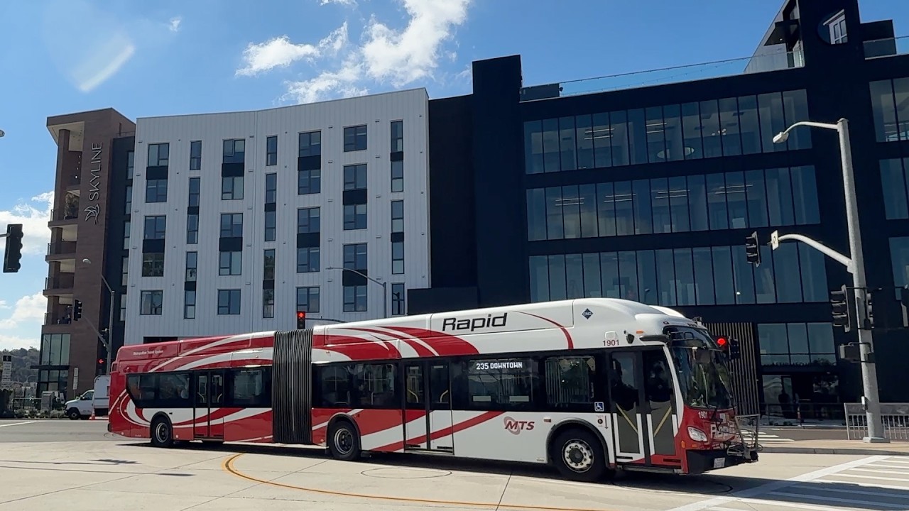 Bus in front of Skyline affording housing