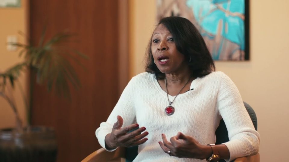woman sitting in a chair talking