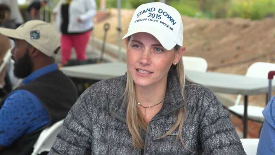 person wears Stand Down hat