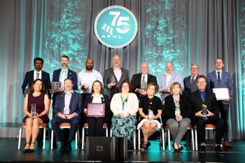 all winners onstage posing for photo
