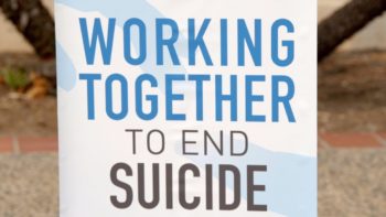 Working Together To End Suicide sign