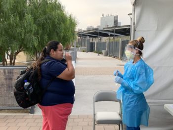 woman getting a COVID-19 test