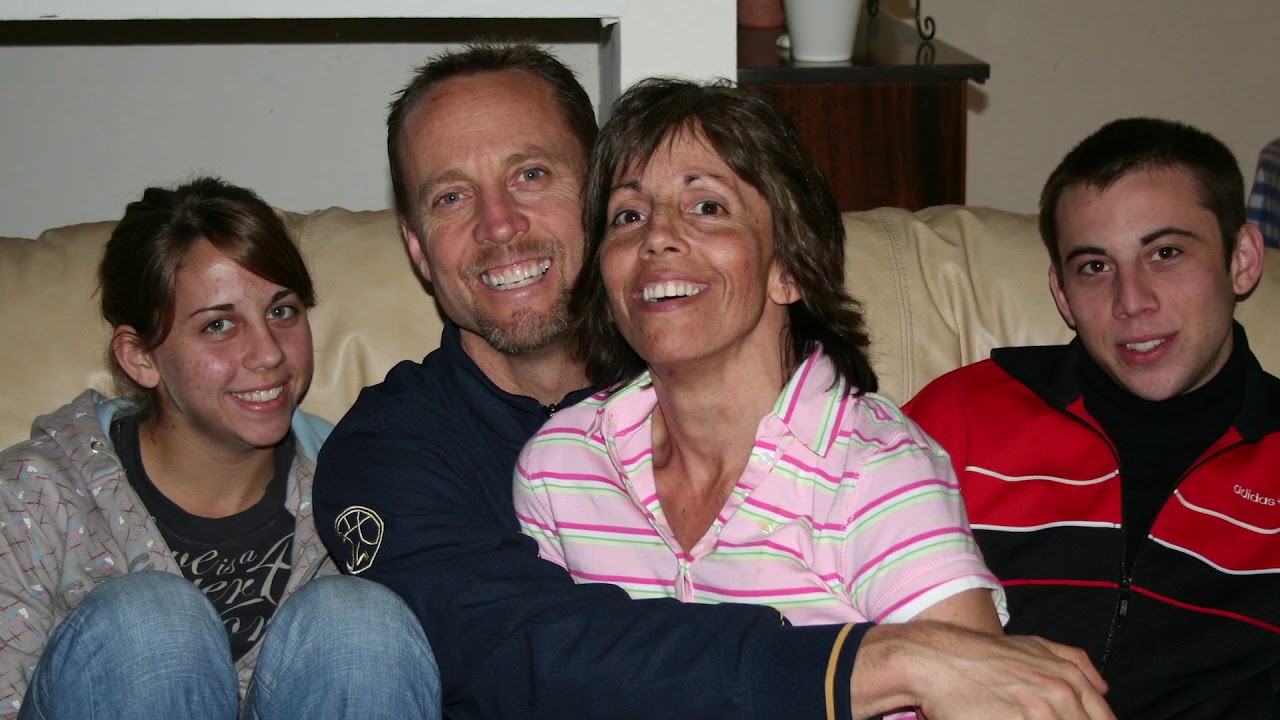 couple and two children on a couch