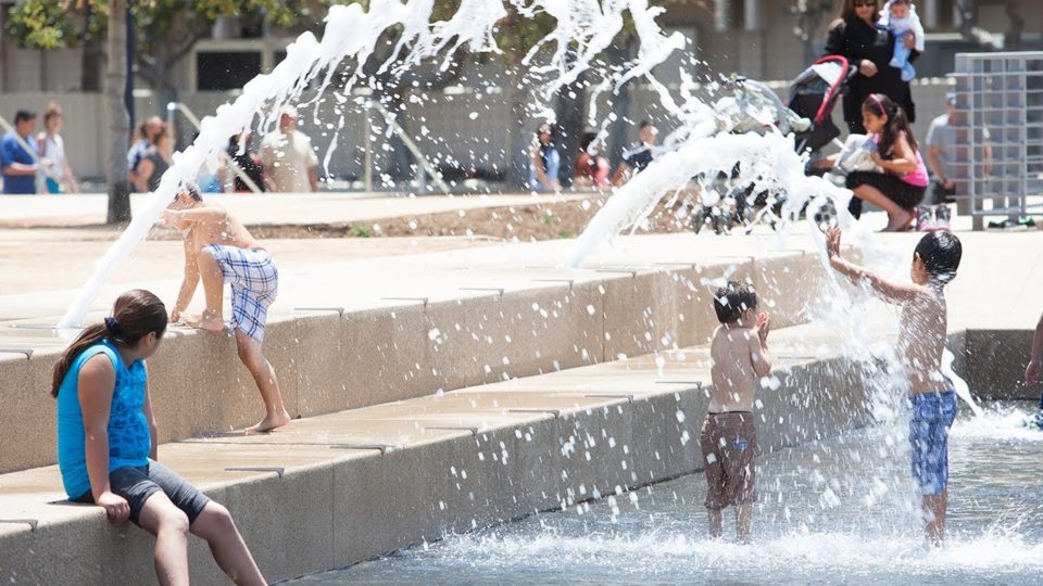 children playing in a fountain at Waterfront Park