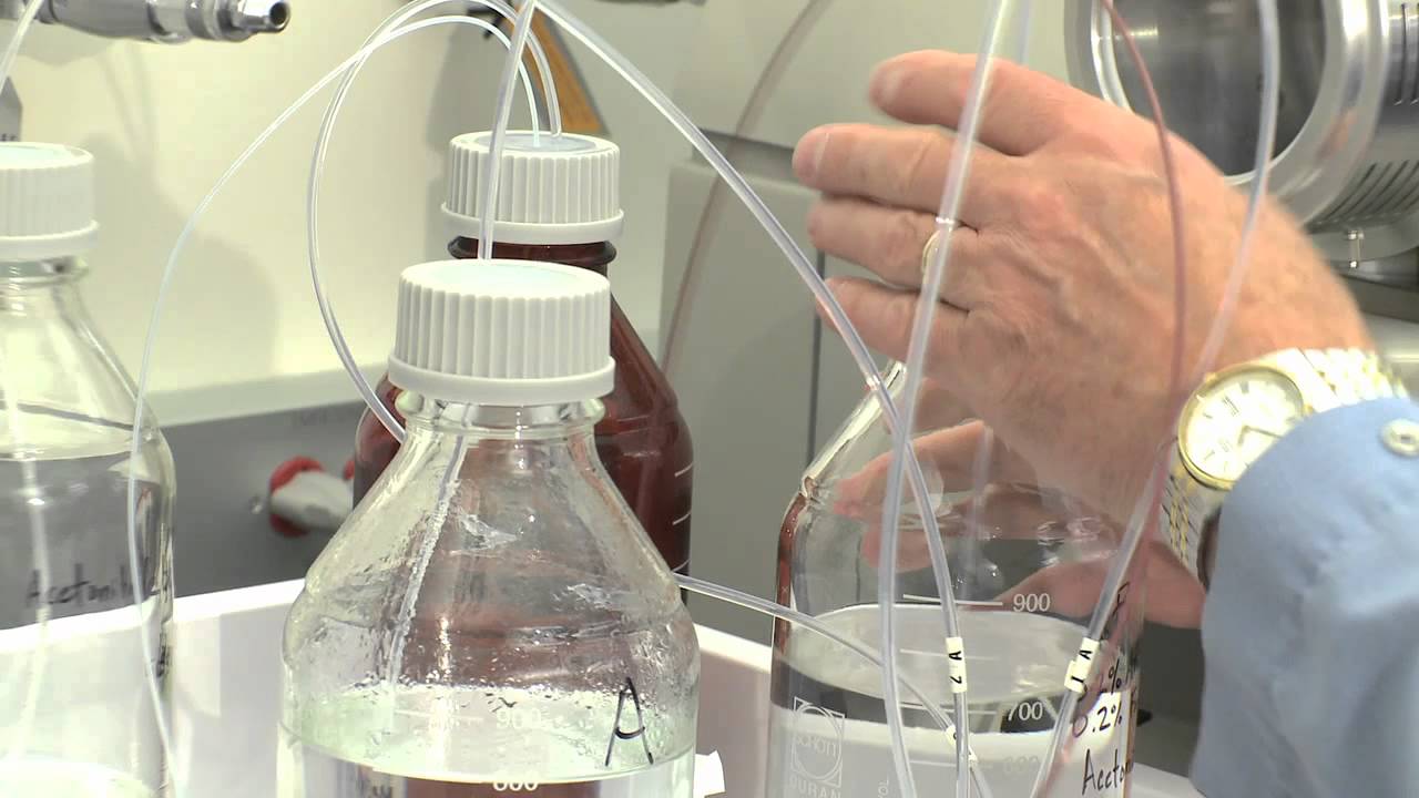 photo of a hand with tubes of water timing test.