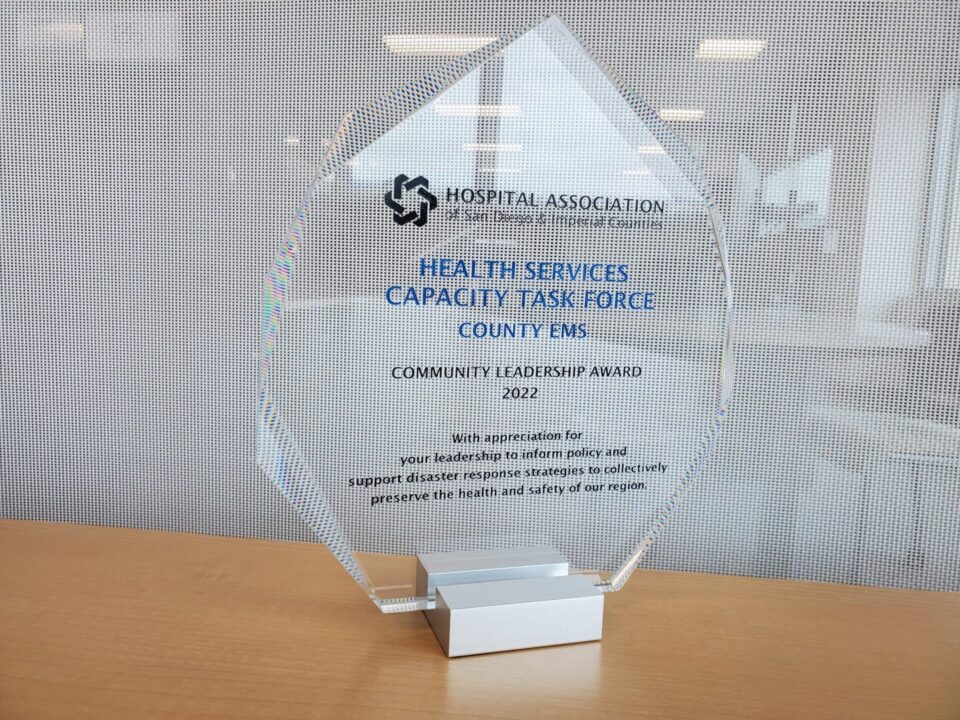 glass plaque award from the Hospital Association of San Diego and Imperial Counties that reads Health Services Capacity Task Force, County EMS, Community Leadership Award 2022, with appreciation for your leadership to inform policy and support disaster response strategies to collectively preserve the health and safety of our region