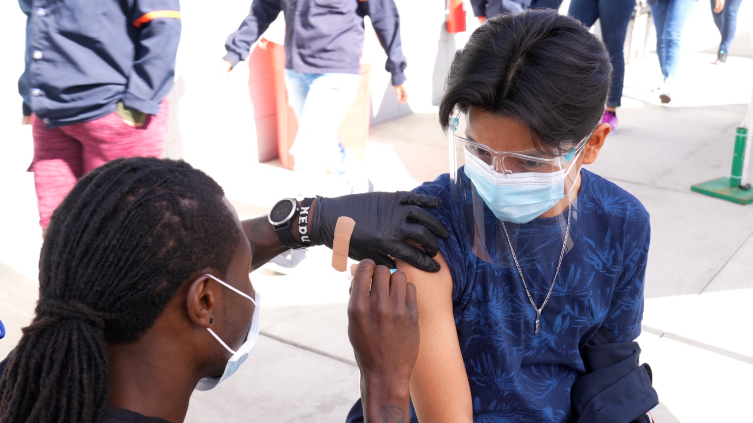 person gets vaccination in arm
