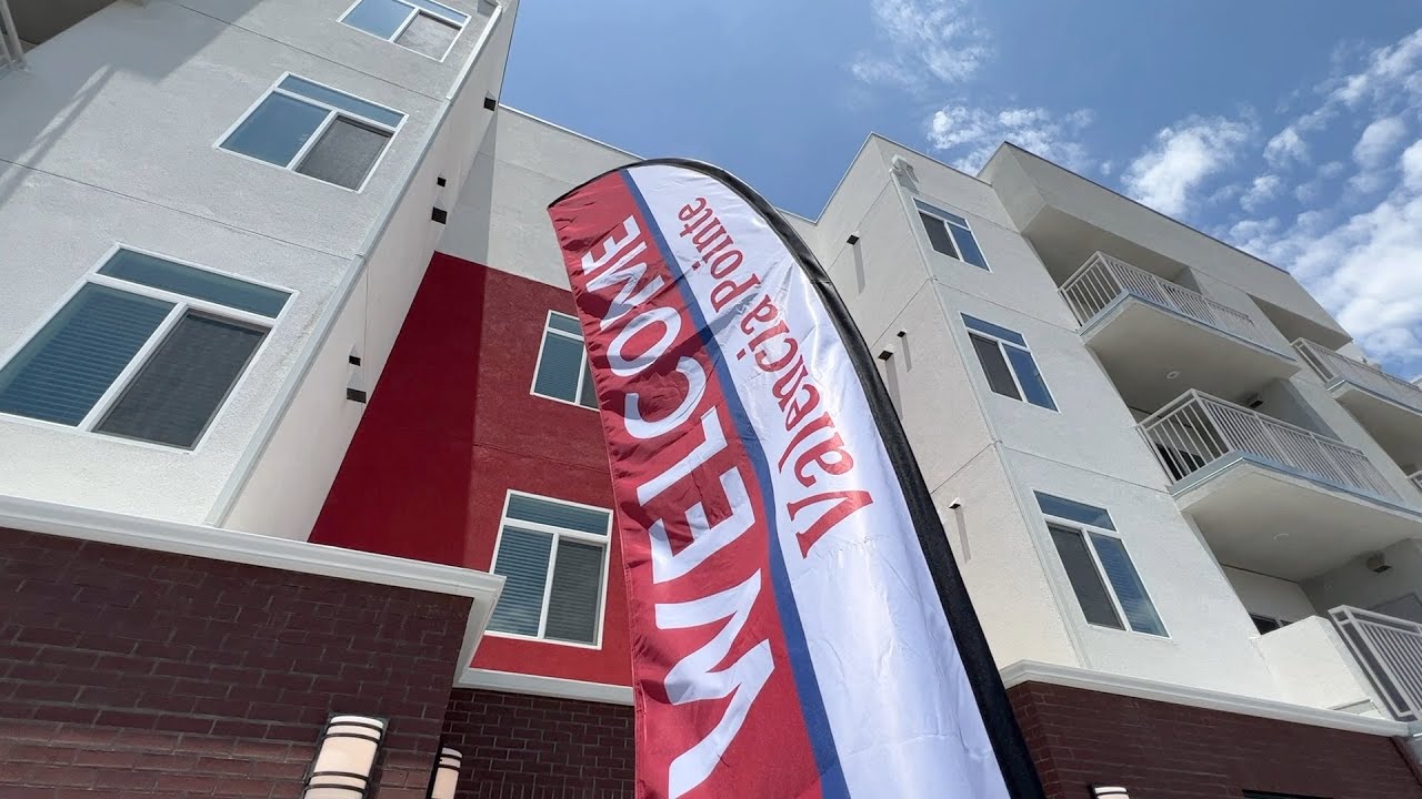 outside of Valencia Pointe with a welcome sign