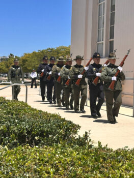 Three-volley salute team march forward with rifles