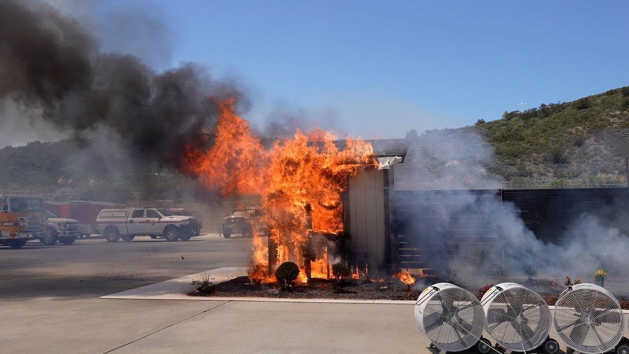 small home fully engulfed in flames